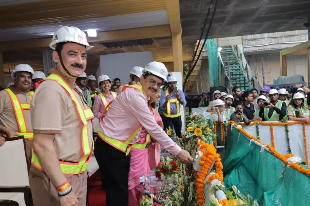 Officials celebrate tunnel breakthrough on DMRC’s Golden Line project.