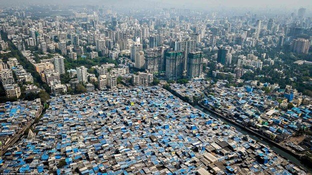 Dharavi aerial view highlighting dense informal housing and workshops. Dharavi Redevelopment Project