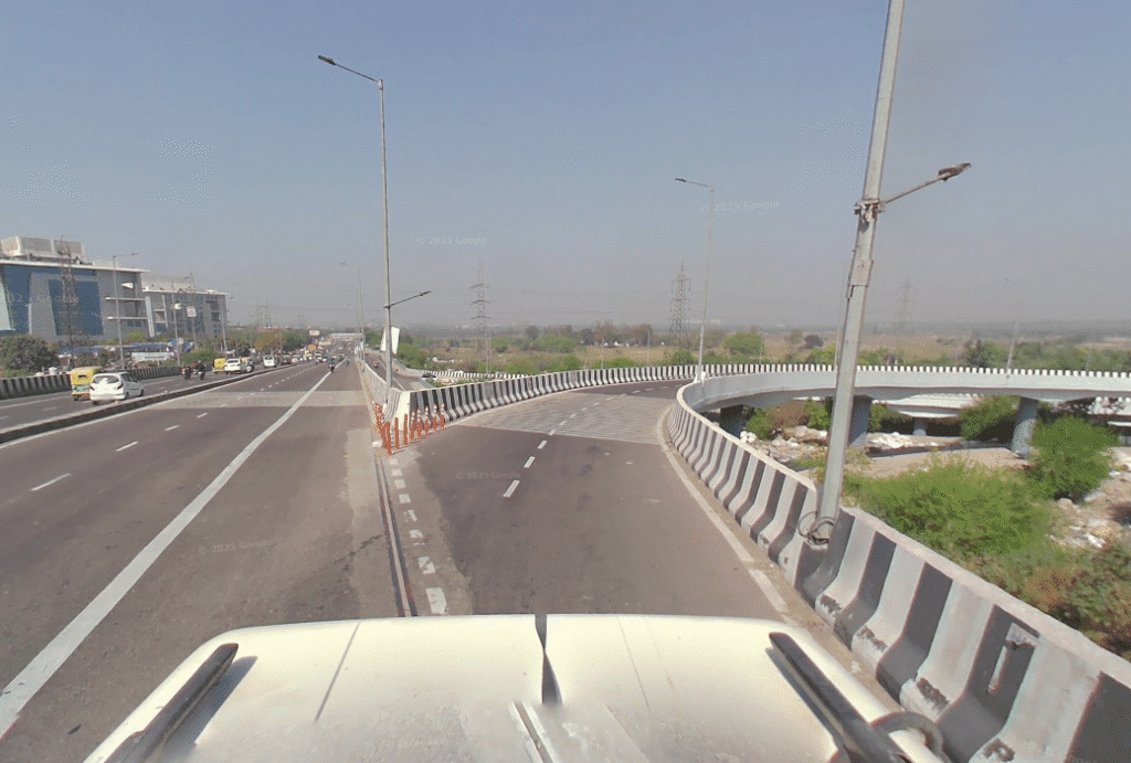 Road Projects Grand Trunk Road flyover and highway section in Delhi with vehicles and service road