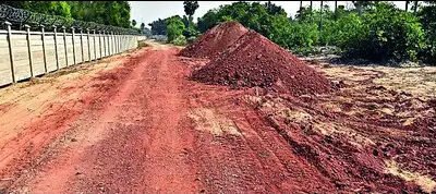 Construction activity and cleared land at proposed Puri airport site, raising environmental concerns over tree felling and CRZ violations.