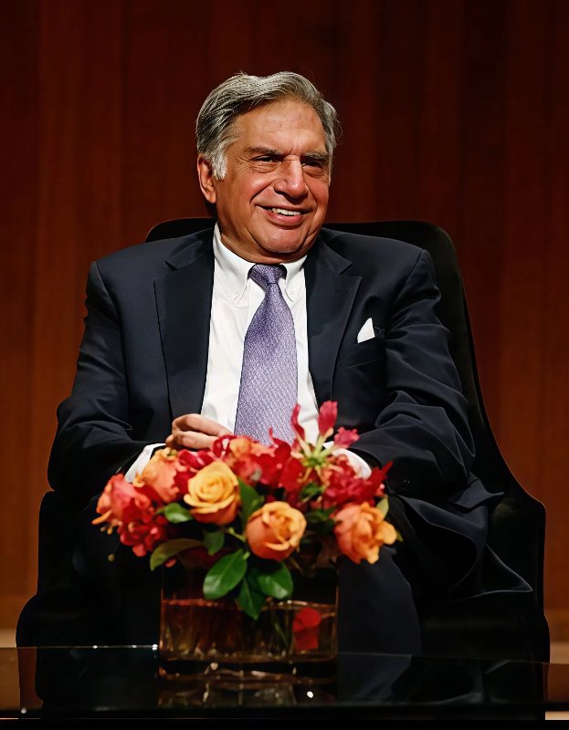Portrait of Ratan Tata, Padma Vibhushan awardee and visionary industrialist, seated with flowers.