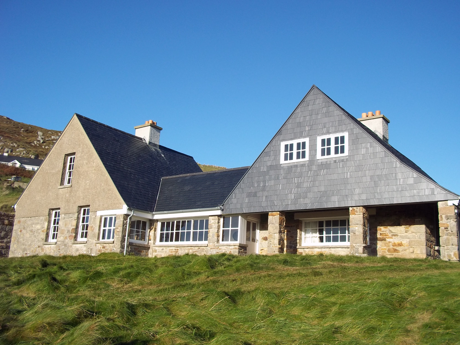 Tranarossan House in County Donegal, designed by Sir Edwin Lutyens using local granite and traditional gabled forms.