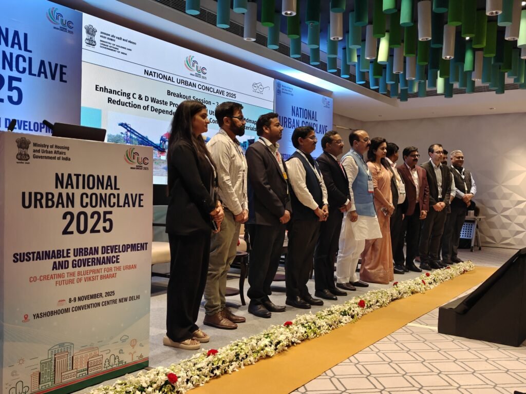 Panelists and dignitaries pose for a group photograph after the C&D Waste breakout session at the National Urban Conclave 2025.