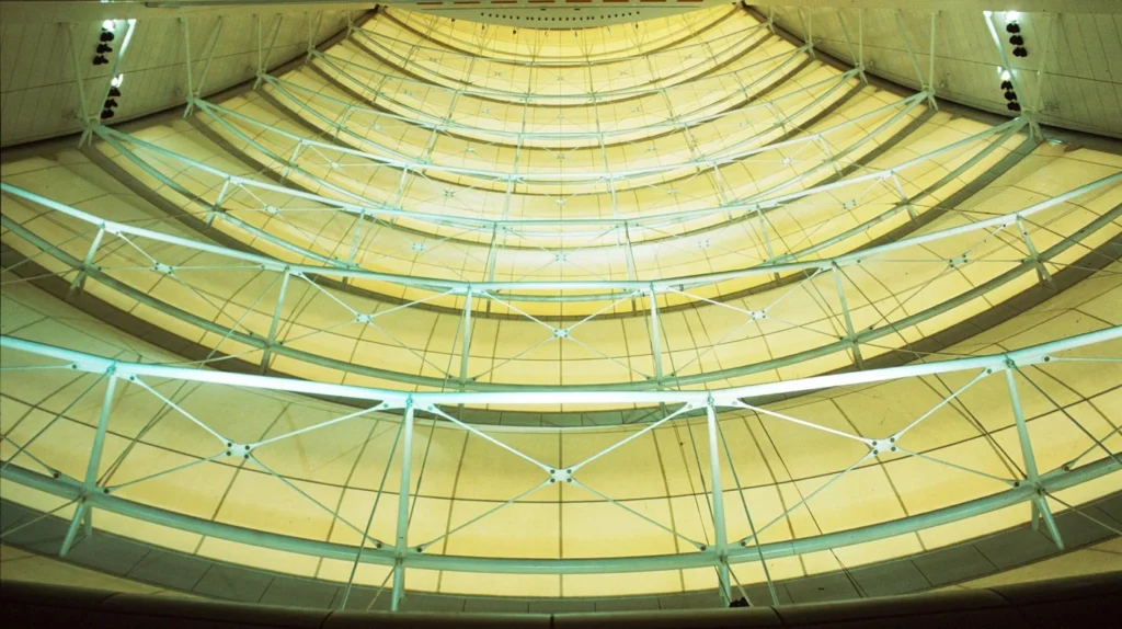 Close-up view of the internal fabric wall and steel tension framework inside the Burj Al Arab, highlighting its structural engineering design.
