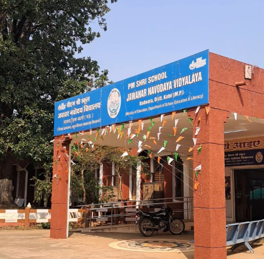 Entrance of PM SHRI School Jawahar Navodaya Vidyalaya in Banjari, Kaimur district, Madhya Pradesh, decorated with tricolour flags under the PM SHRI initiative.