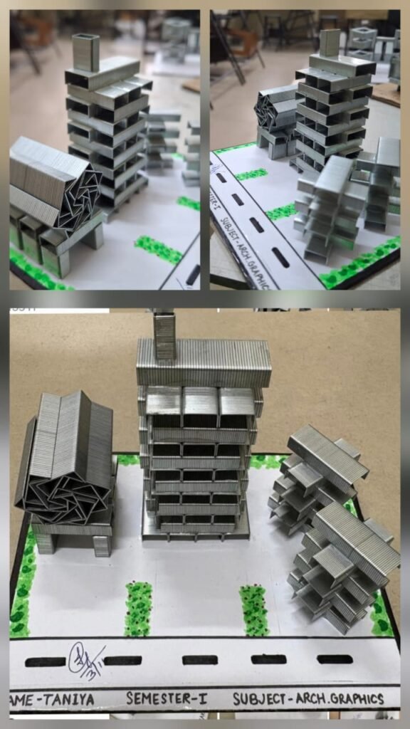 A series of stapler-pin building models arranged on a site layout by architecture student Taniya, featuring towers, block forms, and green landscape elements.