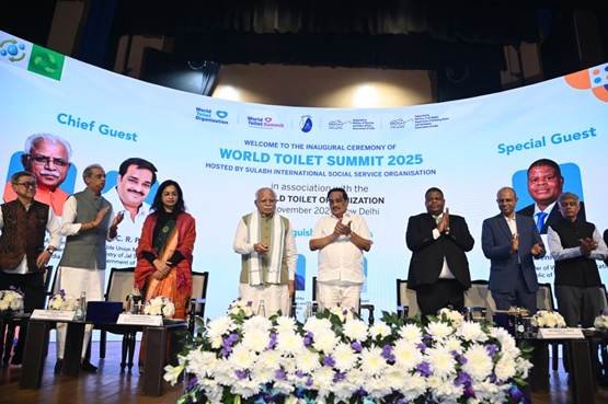 Senior government officials, international delegates, and representatives stand on stage during the inaugural ceremony of the World Toilet Summit 2025 in New Delhi, hosted by Sulabh International and the World Toilet Organization.