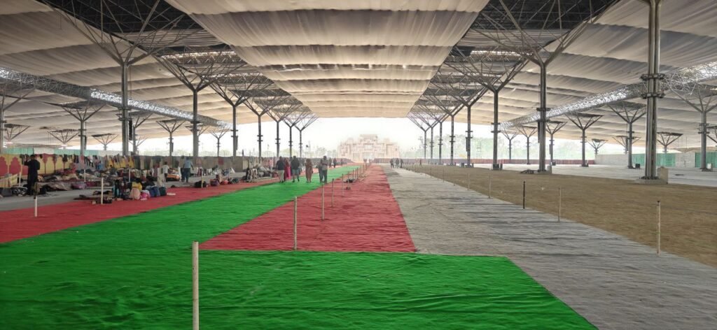 Tensile metal truss structure covering the main congregation area at the Sant Nirankari Samagam site in Samalkha.