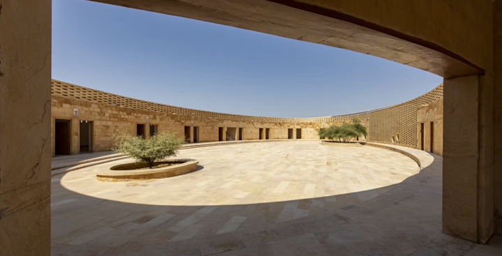 Photograph of patterned shadows cast by jali screens on interior floors and courtyard.