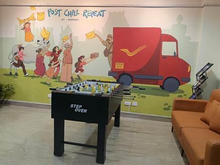Interior view of the Gen-Z themed campus Post Office at VIT-AP University featuring modern counters and seating