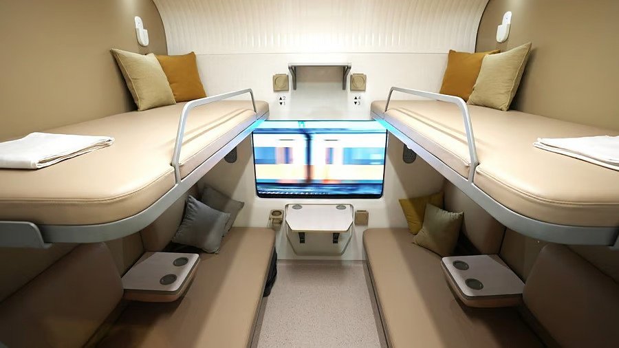 Interior view of Vande Bharat Sleeper Train showing modern berths, ergonomic seating, and passenger comfort features