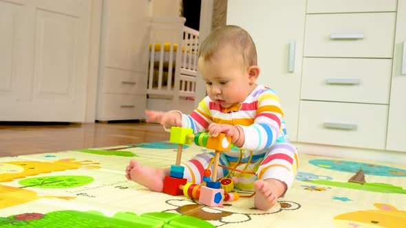 Infant playing with colorful wooden toys indoors, symbolizing early childhood development and the future generation of cities