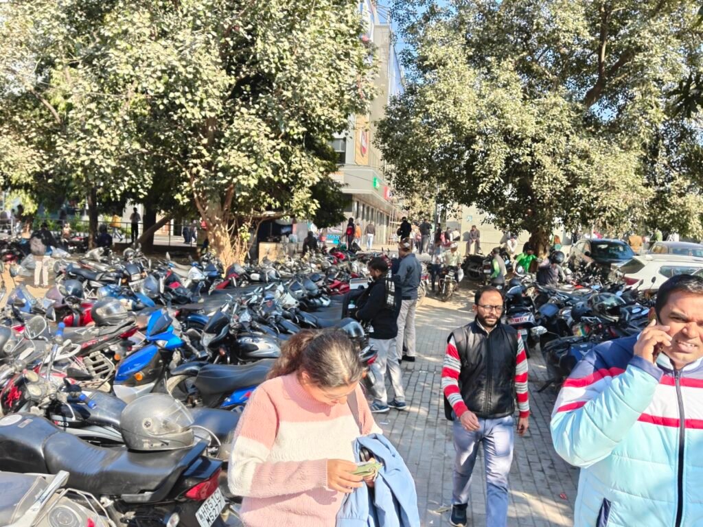 Motorcycle parking and pedestrian circulation coexisting in public space at Nehru Place, Delhi