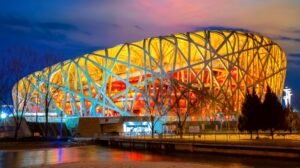 Bird’s Nest Stadium Beijing illuminated exterior steel lattice structure at night