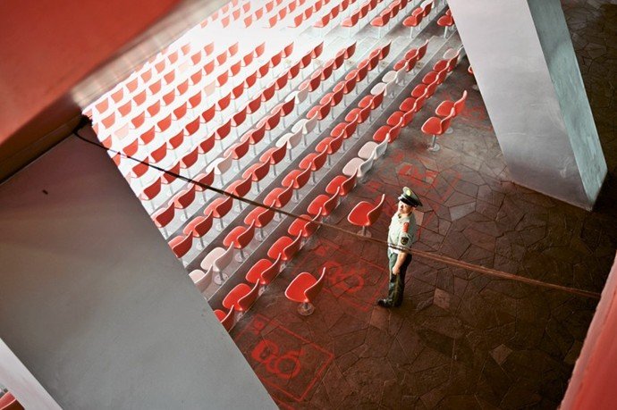 Bird’s Nest stadium seating layout red chairs human scale circulation