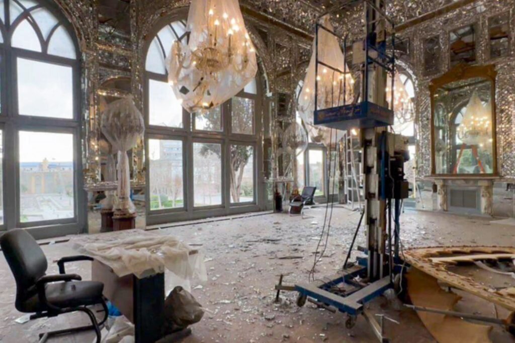 Damaged interior of Golestan Palace Tehran with shattered glass and debris after military strikes