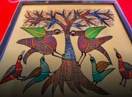 Gond painting showing tree and birds with intricate patterns
