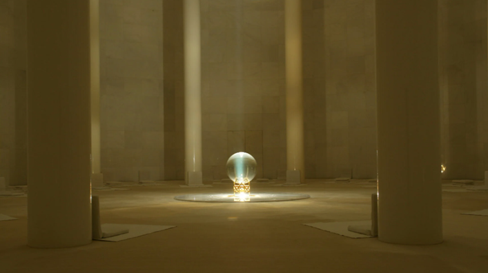 Inner meditation chamber of Matrimandir with crystal globe illuminated by sunlight