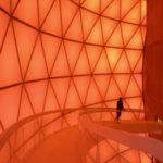 Interior view of Matrimandir showing translucent inner skin illuminated with soft golden light