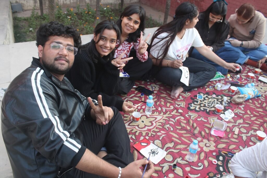 Students painting canvas artwork during NEXUS 2026 creative session