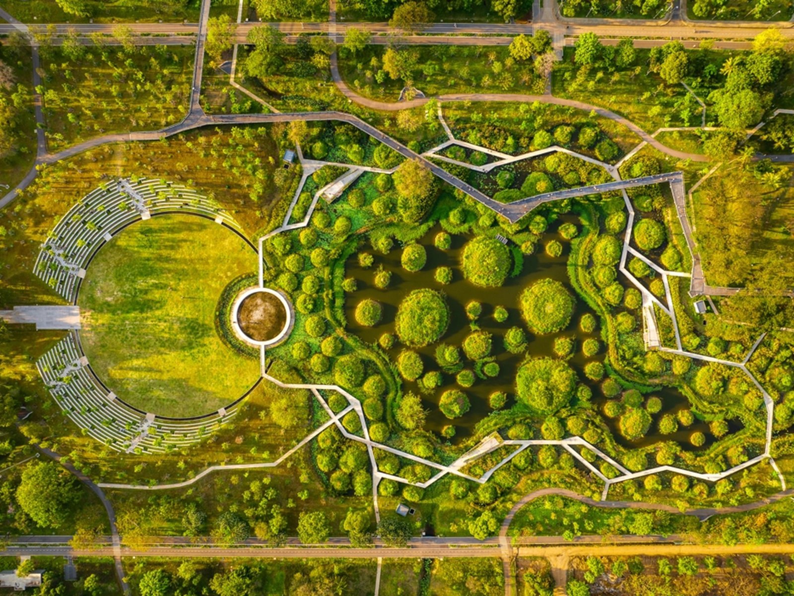 Aerial view of an ecological wetland park designed using sponge city principles for urban flood management and landscape infrastructure.