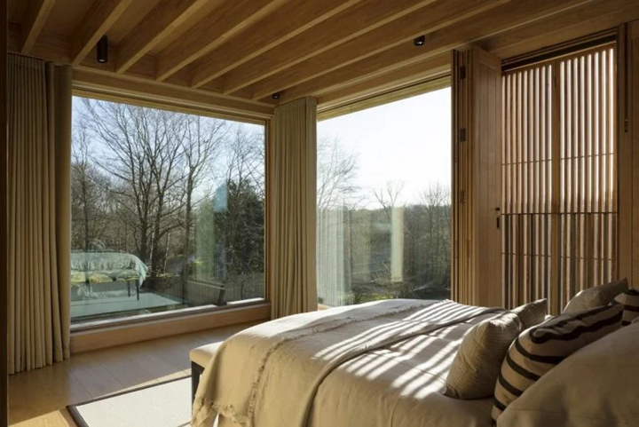 Interior bedroom of Hampshire House with large window and natural light