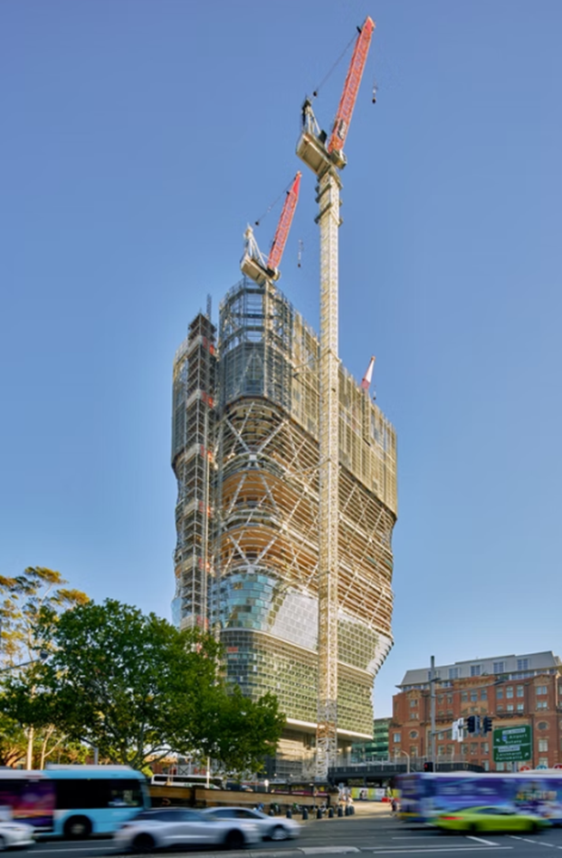 Street view of Atlassian Central construction near Central Station Sydney with pedestrians and vehicles