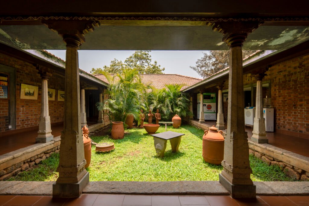 Reception courtyard at Dakshinachitra with exposed brick and traditional columns