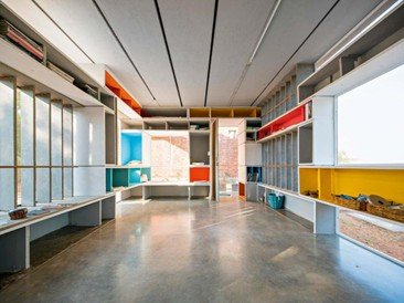 Modular interior space designed by Anupama Kundoo with integrated storage and colorful functional architecture