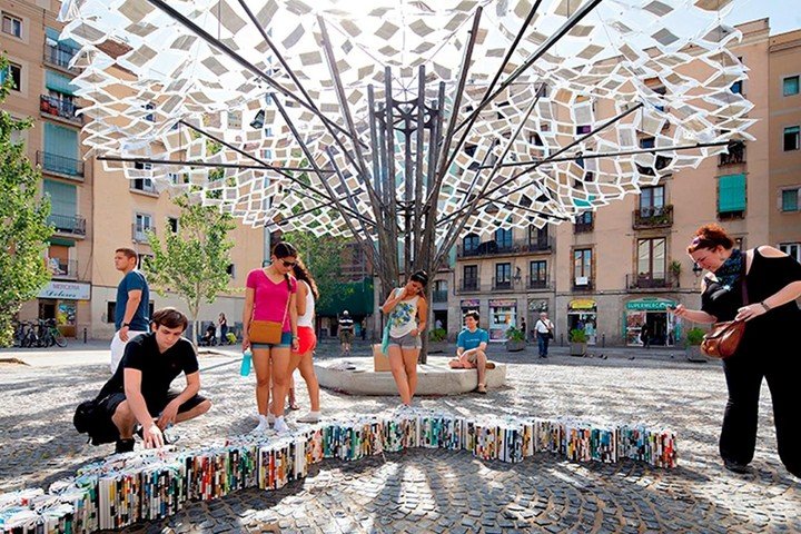 Public art installation made from suspended recycled books designed by architect Anupama Kundoo in an urban plaza