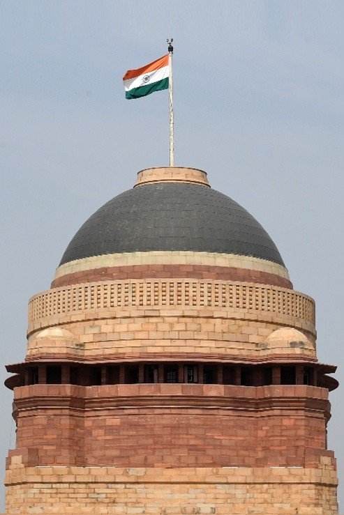 Close-up view of Rashtrapati Bhavan dome with Indian national flag
