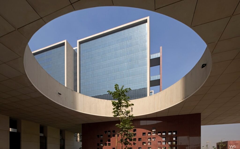 Circular courtyard opening framing Surat Diamond Bourse towers