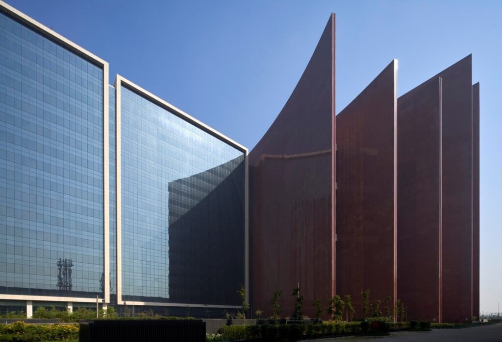 Glass office towers and sandstone walls at Surat Diamond Bourse