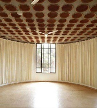 Interior space with terracotta pot ceiling system designed by architect Anupama Kundoo for passive cooling and sustainable architecture