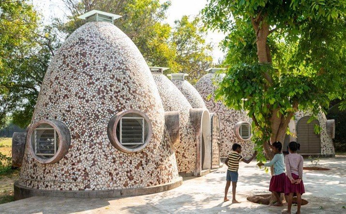 Dome-shaped sustainable housing units designed by Anupama Kundoo for homeless children using earth-based construction techniques