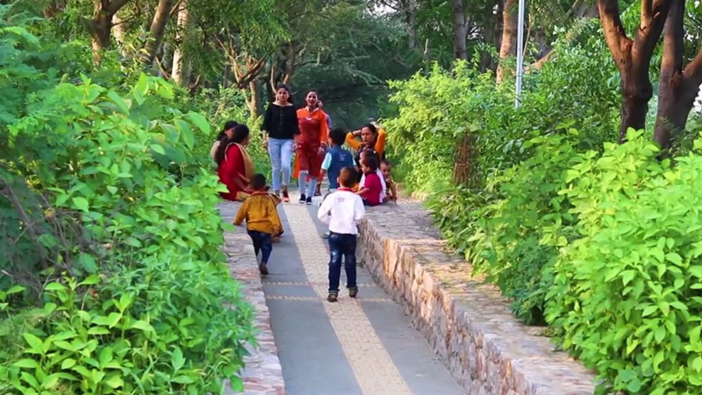Residents, women, and children using the Bundh Rejuvenation Trail in Gurugram, an award-winning urban regeneration and ecological restoration project.