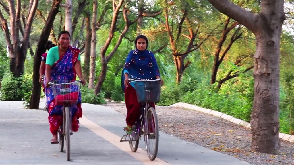 Women cyclists using the Bundh Rejuvenation Trail, highlighting safe and inclusive non-motorised mobility infrastructure.