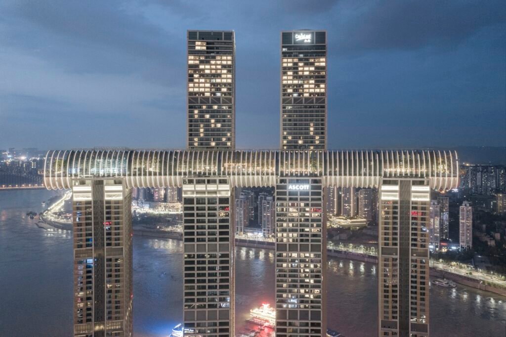 The Crystal horizontal skyscraper connecting towers above Chongqing at night