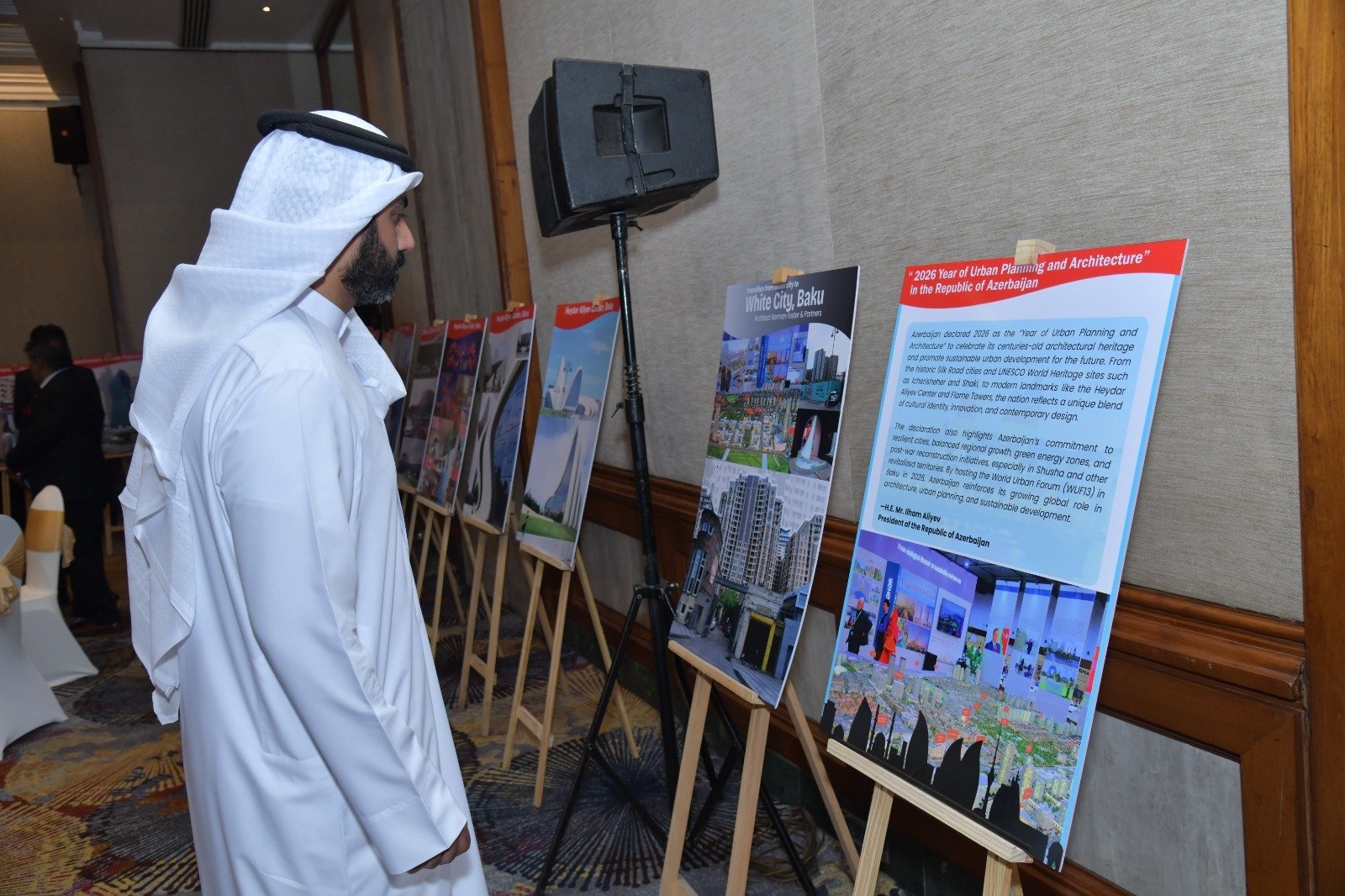 Visitor viewing architecture and urban development exhibition panels curated by Rajendra Kumar.
