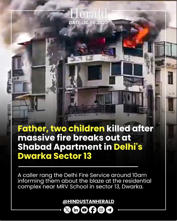 Flames and thick smoke engulfing an apartment building in Dwarka Sector 13, Delhi.