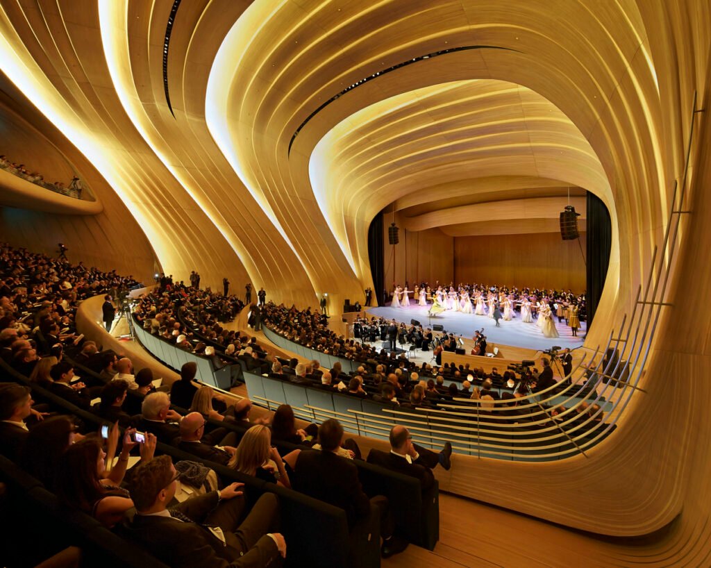 Auditorium inside the Heydar Aliyev Center featuring sculptural interiors designed by Zaha Hadid.