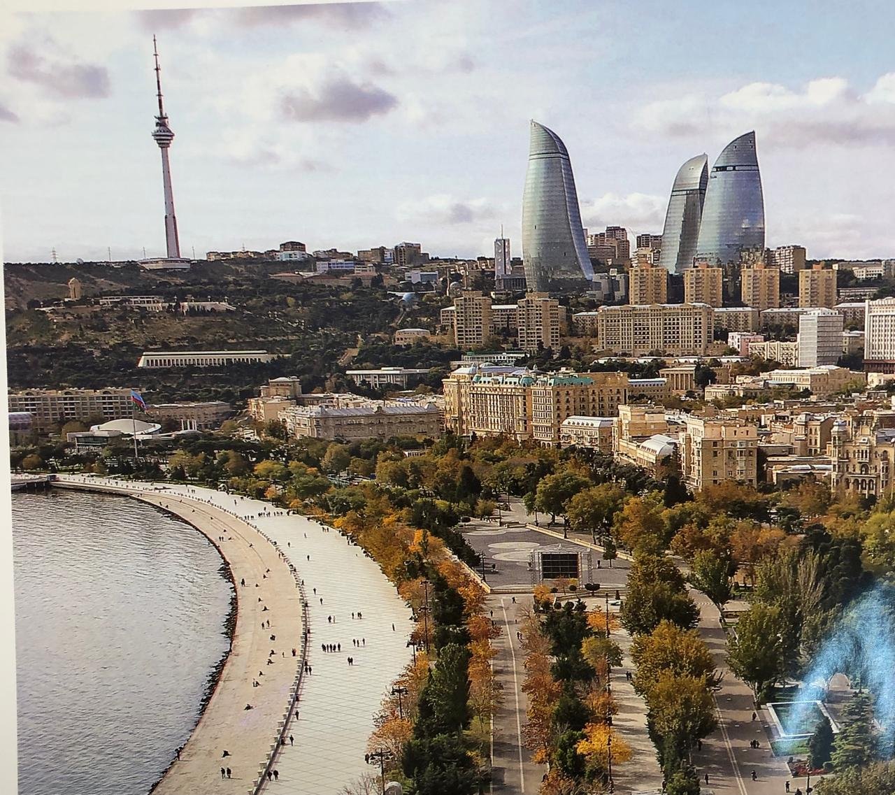 Baku city skyline with modern towers, historic urban areas and the Caspian Sea waterfront.