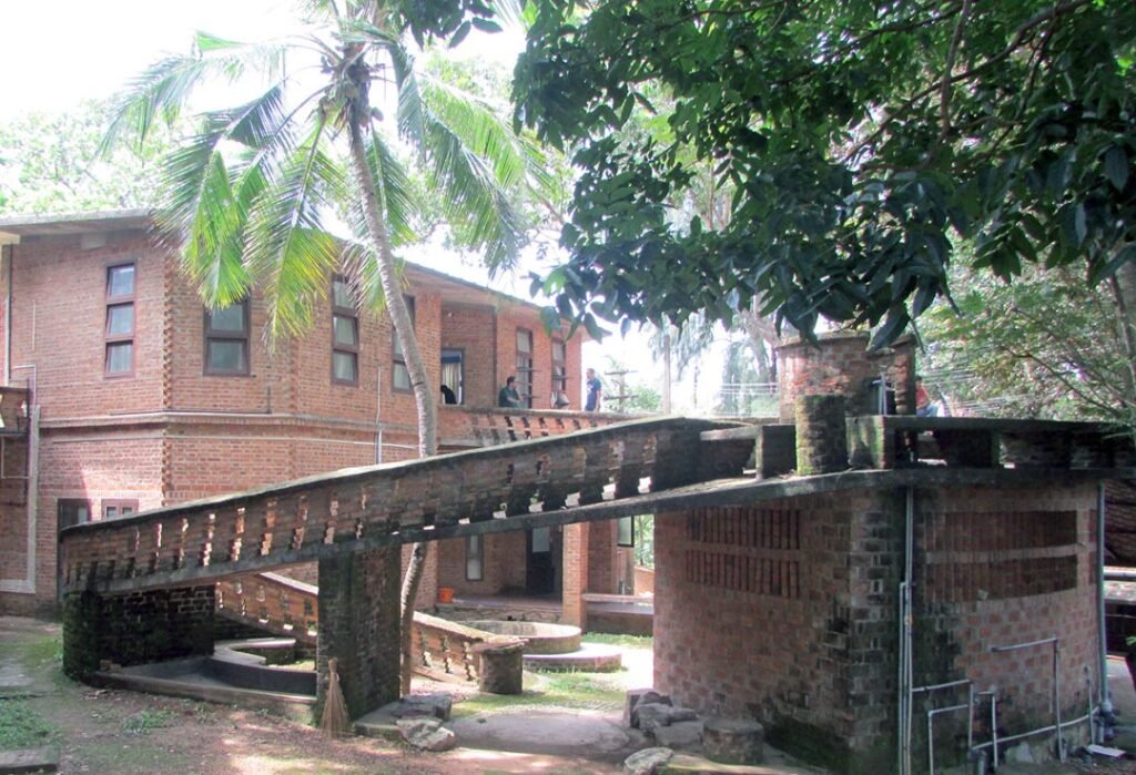 Laurie Baker’s brick auditorium integrated with the landscape at CDS